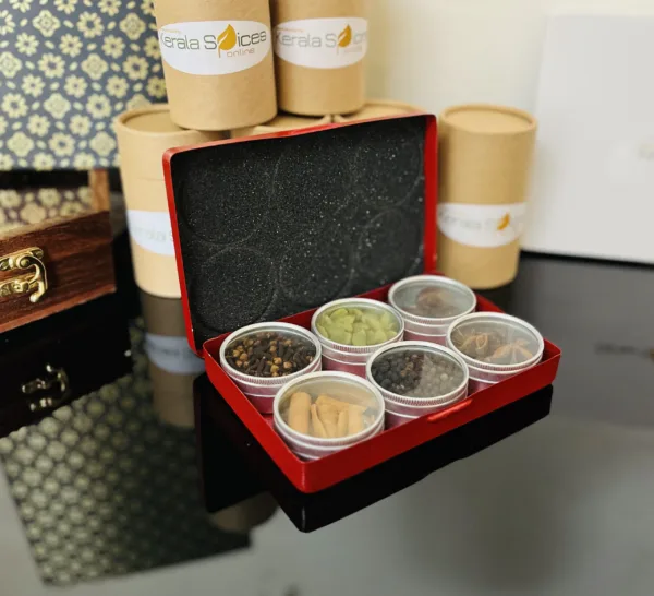red box containing six small containers filled with 6 different spices