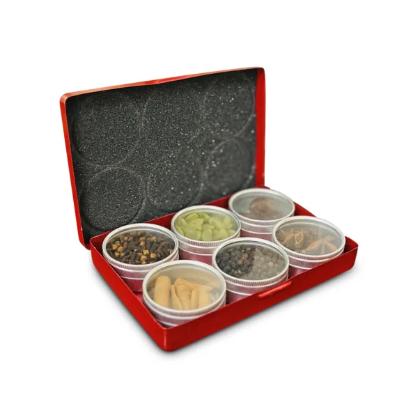 red box containing six small containers filled with 6 different spices